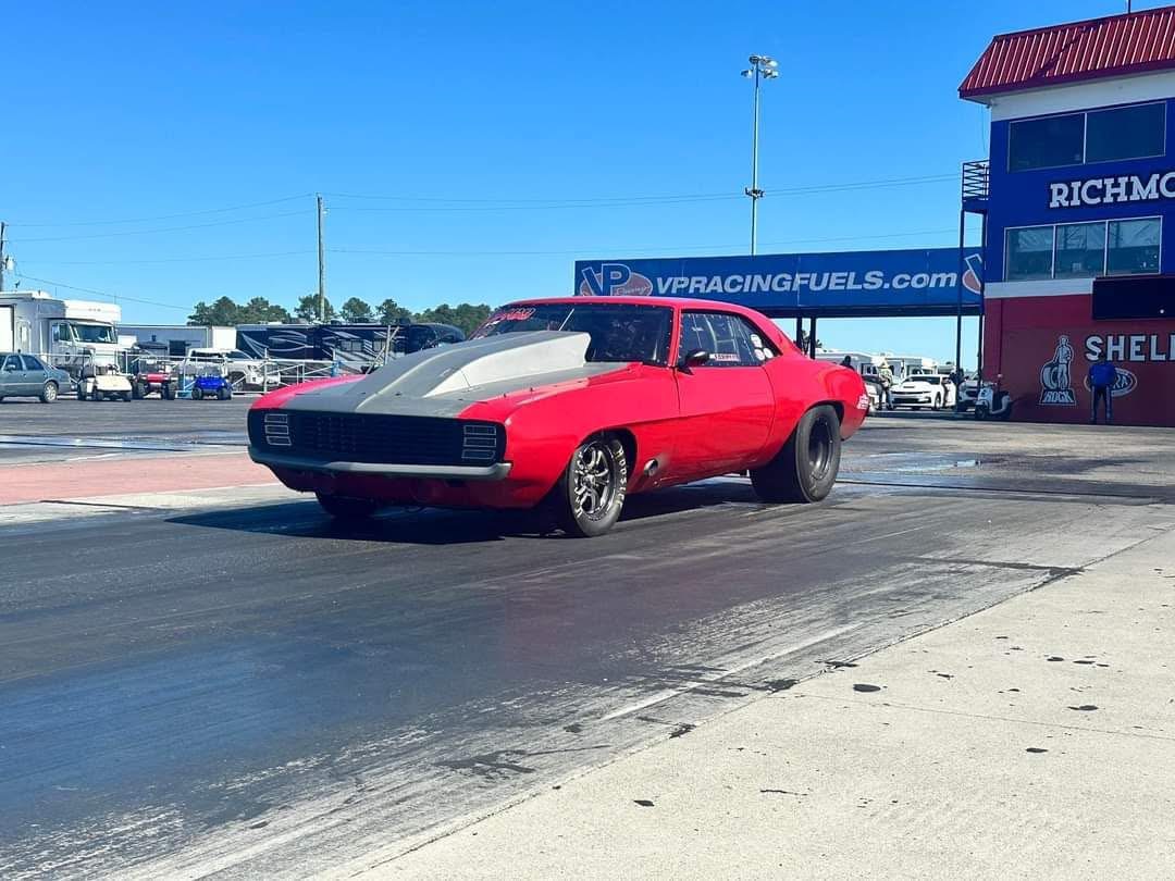 Red Camaro rolling to the staging lanes